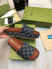 GG THICK PLATFORM SLIDES IN BLUE MONOGRAM EMBOSSED FABRIC