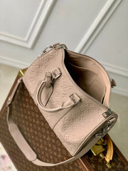 KEEPALL BANDOULIÈRE 34 BAG IN LIGHT BROWN MONOGRAM TAURILLON CALFSKIN