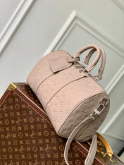 KEEPALL BANDOULIÈRE 34 BAG IN LIGHT BROWN MONOGRAM TAURILLON CALFSKIN