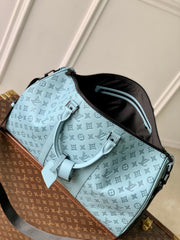 KEEPALL BANDOULIÈRE 50 IN SKY BLUE MONOGRAM SHADOW EMBOSSED CALFSKIN
