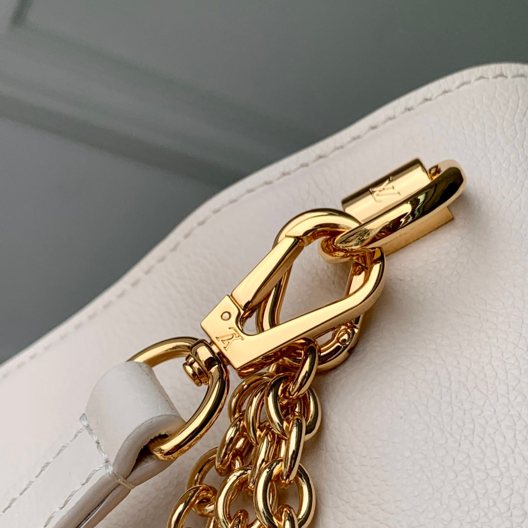 TWIST SLIM 19 IN LIGHT PINK TAURILLON CALFSKIN GOLD HARDWARE