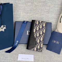 VERTICAL BIFOLD WALLET 19 IN BLACK GRAINED CALFSKIN MIX BLUE MONOGRAM OBLIQUE JACQUARD