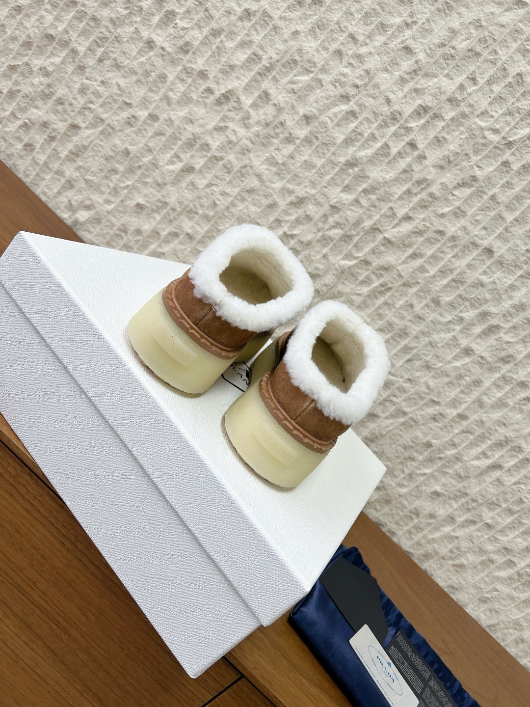 PRADA 25S PLATFORM FUR-LINED MULES IN BROWN SUEDE