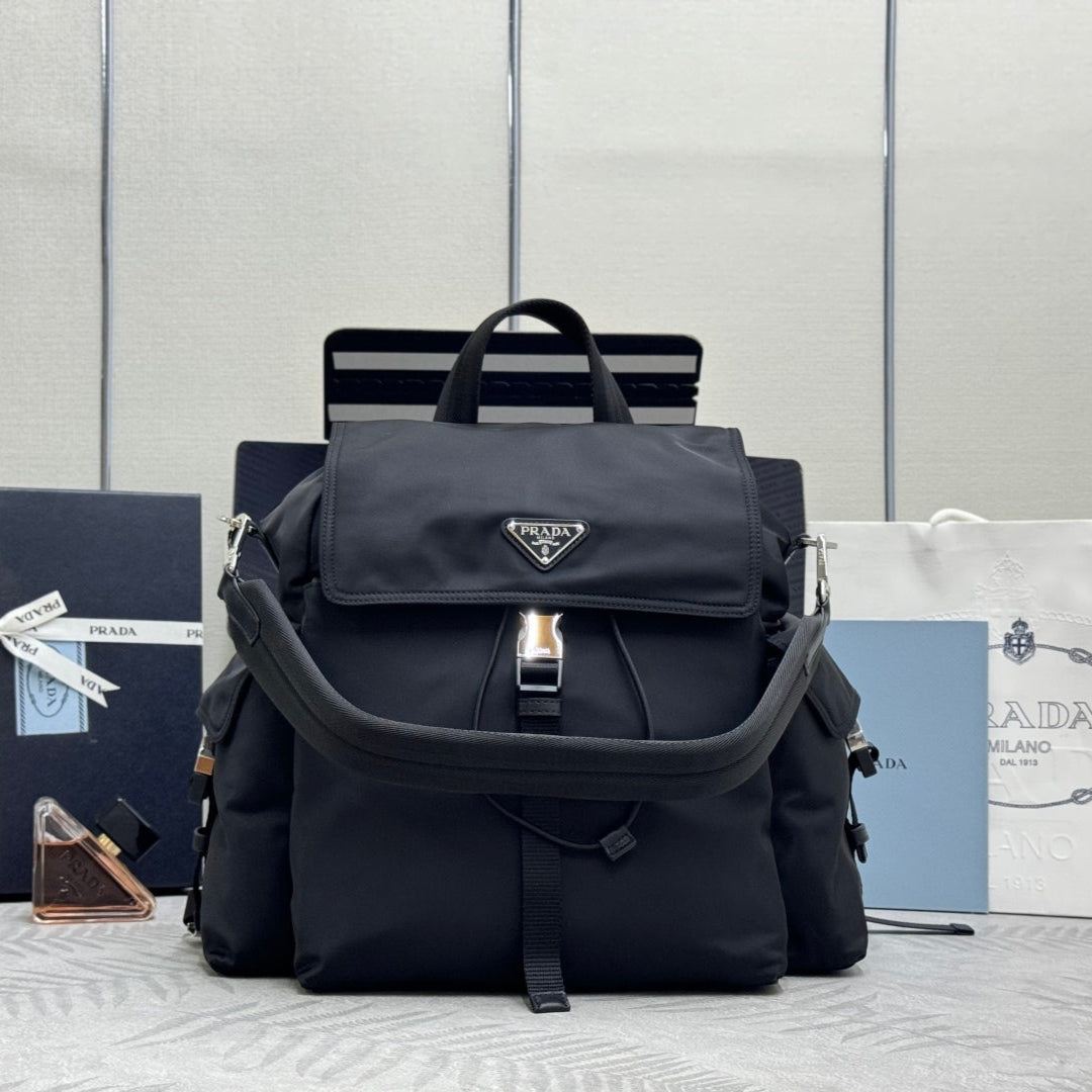 PRADA 25S EXPLORE BACKPACK 39 IN BLACK RE-NYLON AND CALFSKIN