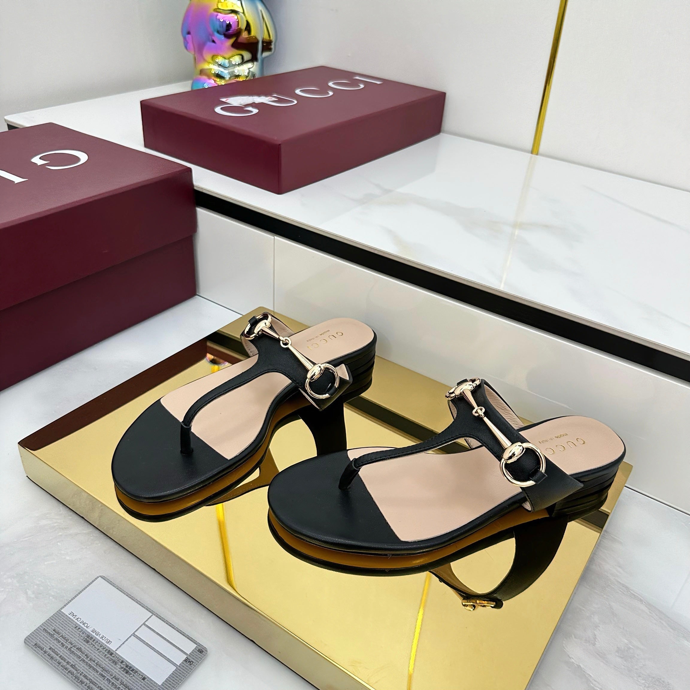 THONG SANDALS IN BLACK LAMBSKIN WITH GOLD HARDWARE