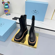 PRADA 25S HIGH MARTIN BOOTS 50MM IN BLACK CALFSKIN