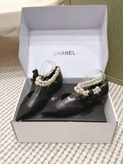 CHANEL 25S ESPADRILLE FLATS IN BLACK CALFSKIN WITH PEARL STRAP