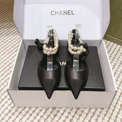 CHANEL 25S ESPADRILLE FLATS IN BLACK CALFSKIN WITH PEARL STRAP