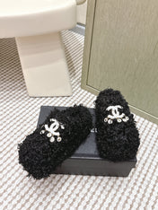 CHANEL 25S CLASSIC FURRY SLIDES IN BLACK WITH DOUBLE C LOGO