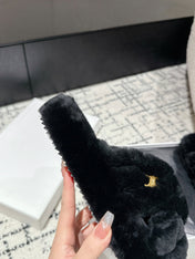 CROSS STRAP SLIPPER IN BLACK SHEARLING