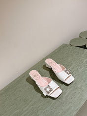 CRYSTAL HEEL MULE IN WHITE SHINY CALFSKIN WITH EMBELLISHED BUCKLE