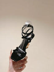 YSL 25S HIGH-HEEL SANDALS 100 MM IN BLACK SATIN WITH YSL LOGO HEEL DESIGN IN GOLD