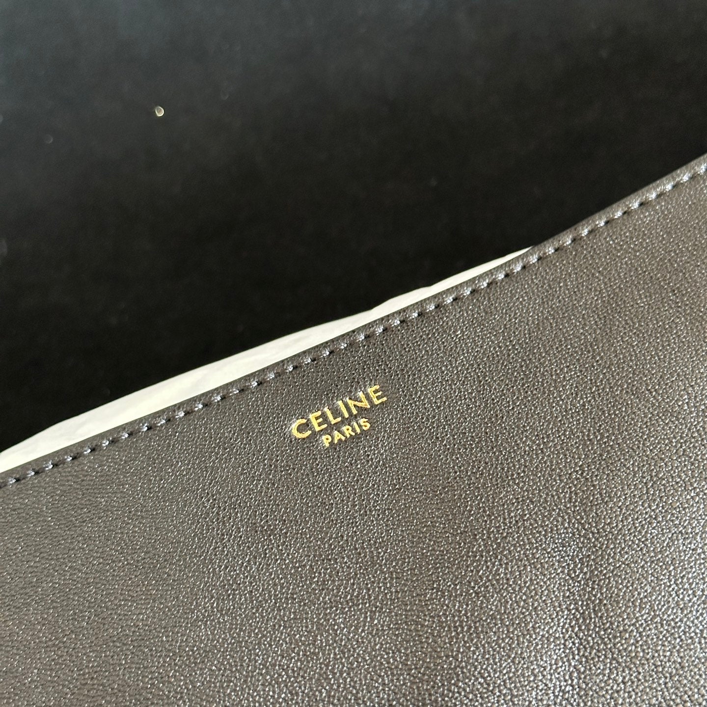 CELINE 25S HALFMOON SOFT TRIOMPHE BAG 46MM IN BLACK SUPPLE SHINY LAMBSKIN