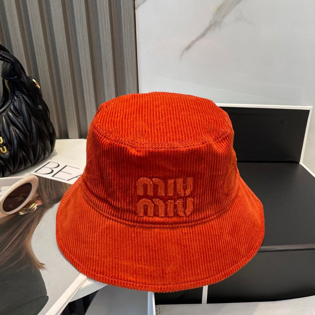 MM BUCKET IN ORANGE VELVET WITH LOGO