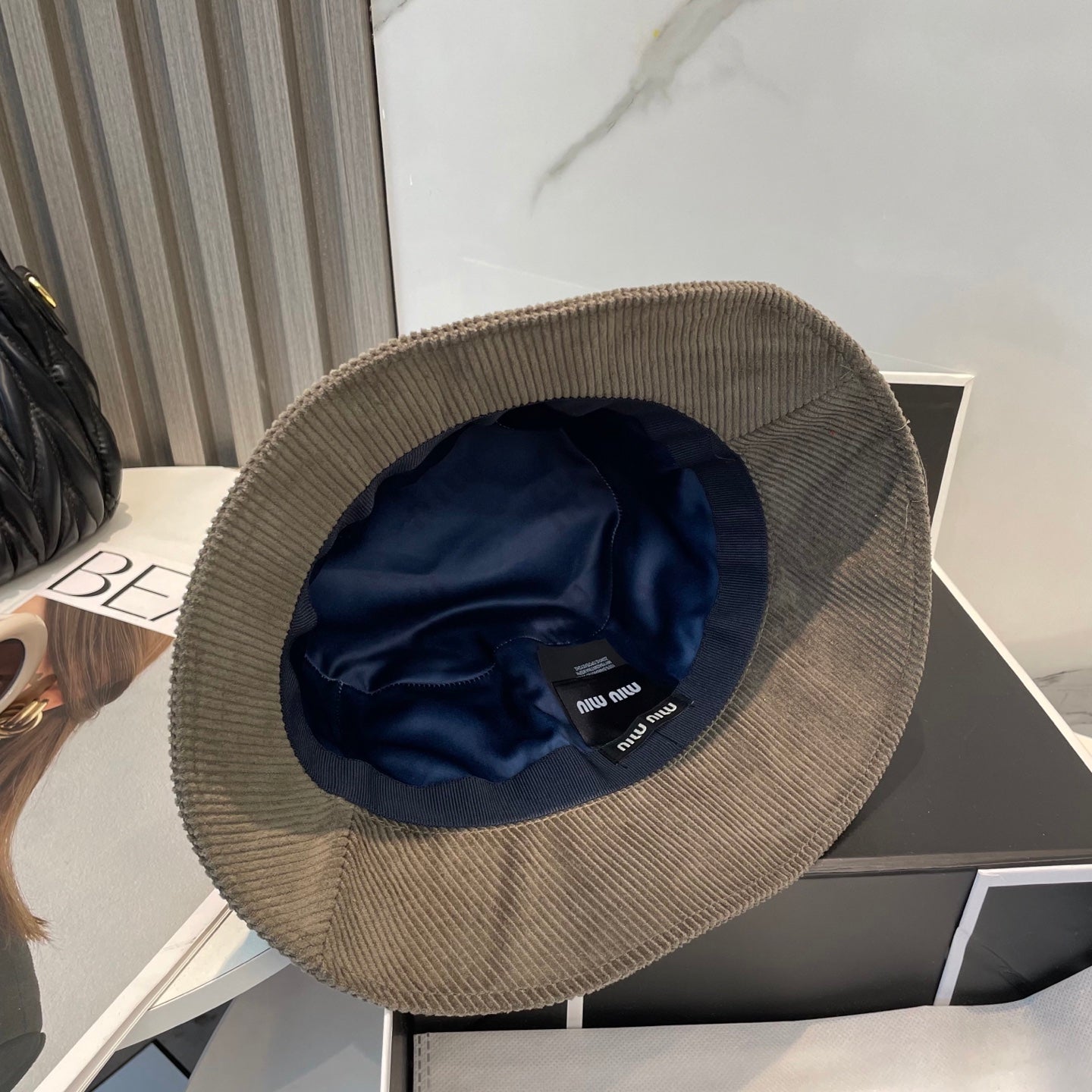 MM BUCKET IN MUTED BROWN VELVET WITH LOGO