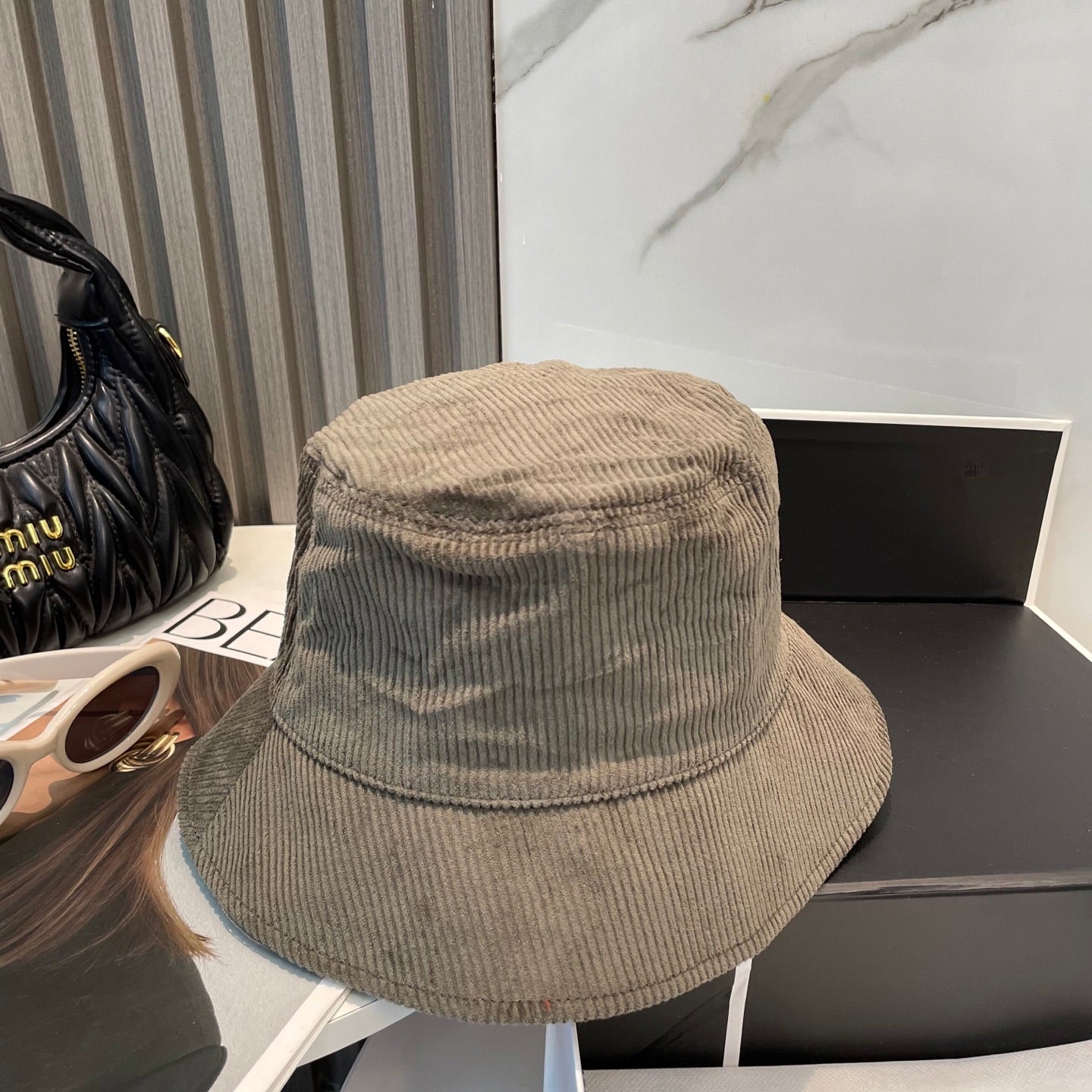 MM BUCKET IN MUTED BROWN VELVET WITH LOGO