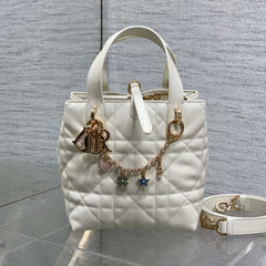 DIOR 25S TOUJOURS VERTICAL TOTE BAG 18 IN IVORY CALFSKIN WITH CHARM BRACELET STRAP