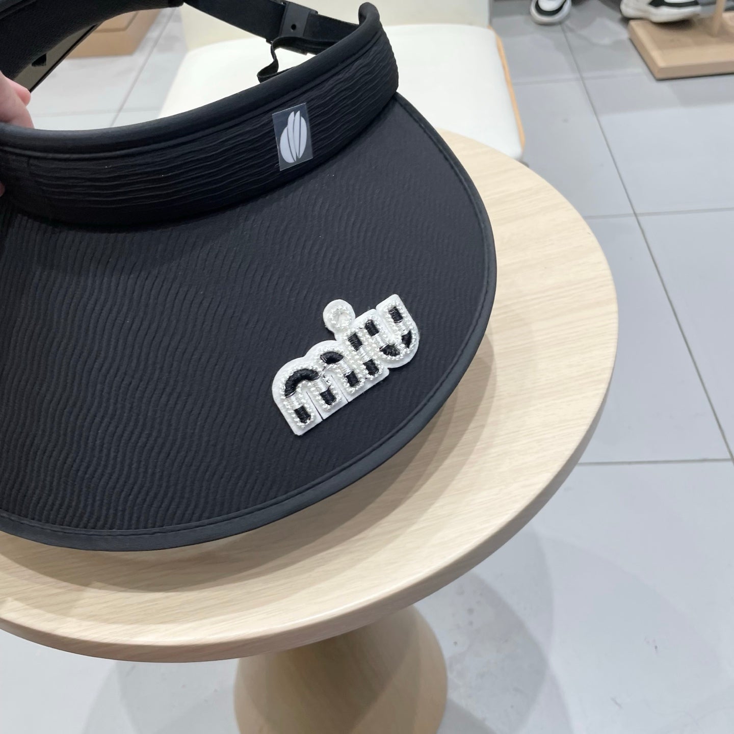 MM FASHION VISOR CAP IN BLACK AND WHITE WITH LOGO TEXT EMBROIDERY