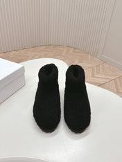 SNOW ANKLE BOOTS IN BLACK SHEARLING
