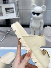 PRADA 25S STRAP SLIDES 30MM IN CREAM CALFSKIN GOLD HARDWARE