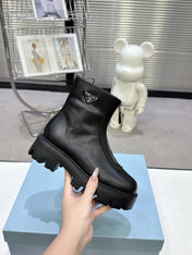 PRADA 25S ZIP-UP ANKLE BOOTS IN BLACK CALFSKIN