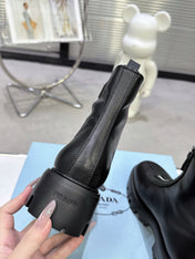 PRADA 25S ZIP-UP ANKLE BOOTS IN BLACK CALFSKIN