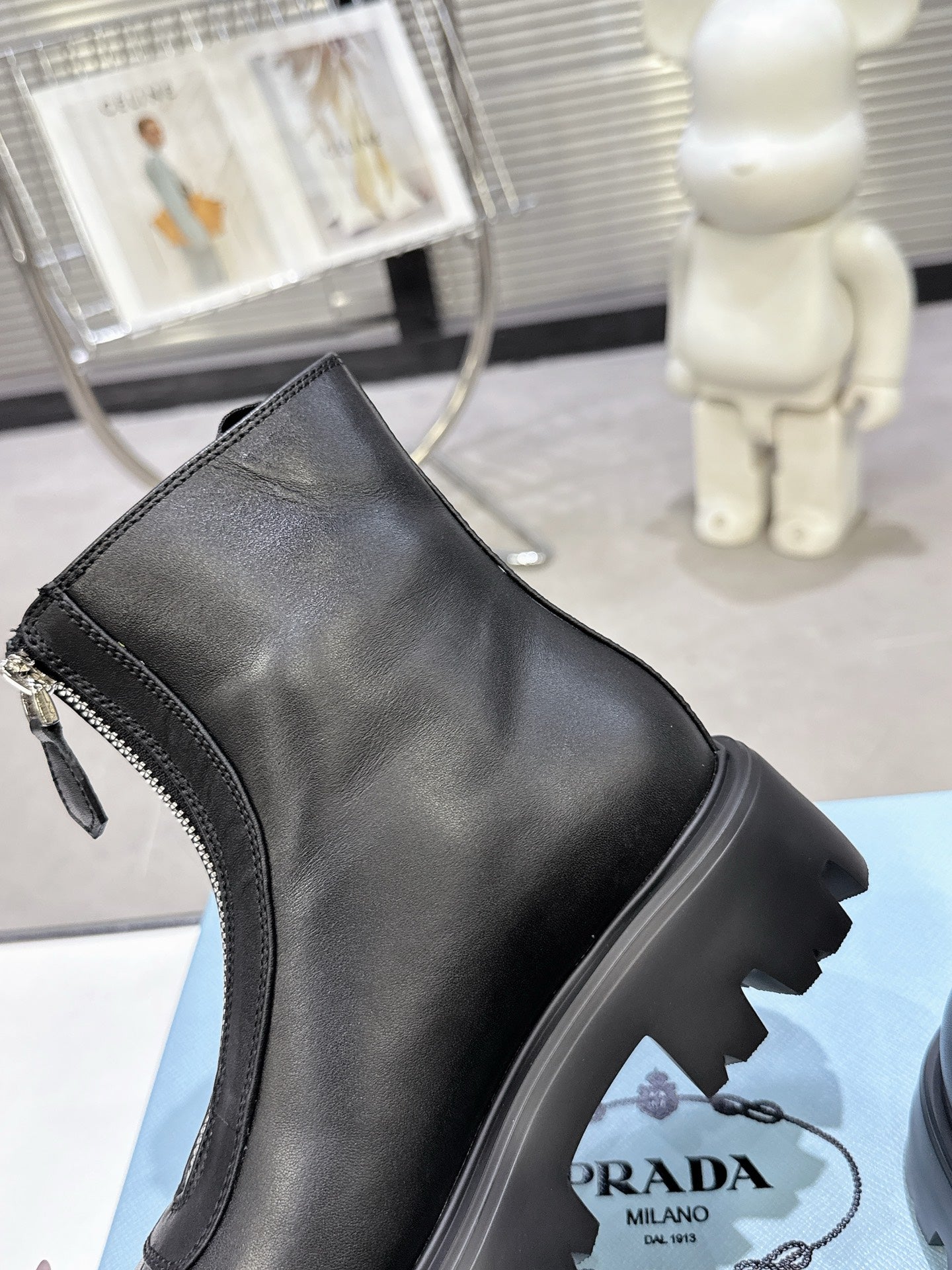 PRADA 25S ZIP-UP ANKLE BOOTS IN BLACK CALFSKIN