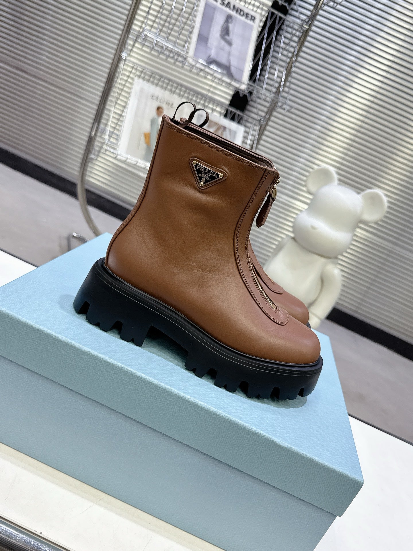 PRADA 25S ZIP-UP ANKLE BOOTS IN BROWN CALFSKIN