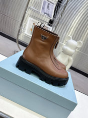 PRADA 25S ZIP-UP ANKLE BOOTS IN BROWN CALFSKIN