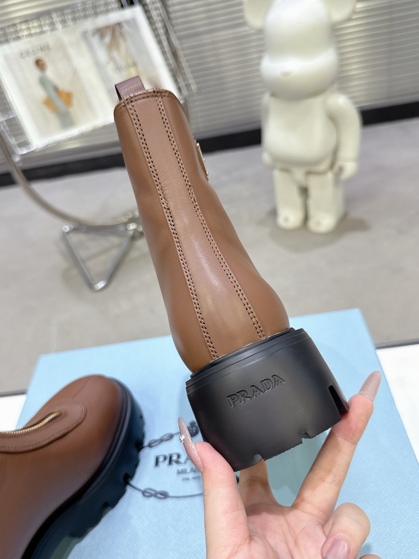 PRADA 25S ZIP-UP ANKLE BOOTS IN BROWN CALFSKIN