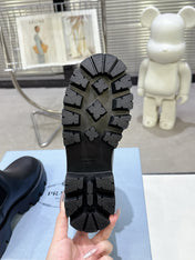 PRADA 25S RETRO PLATFORM MARTIN ANKLE BOOTS IN BLACK CALFSKIN