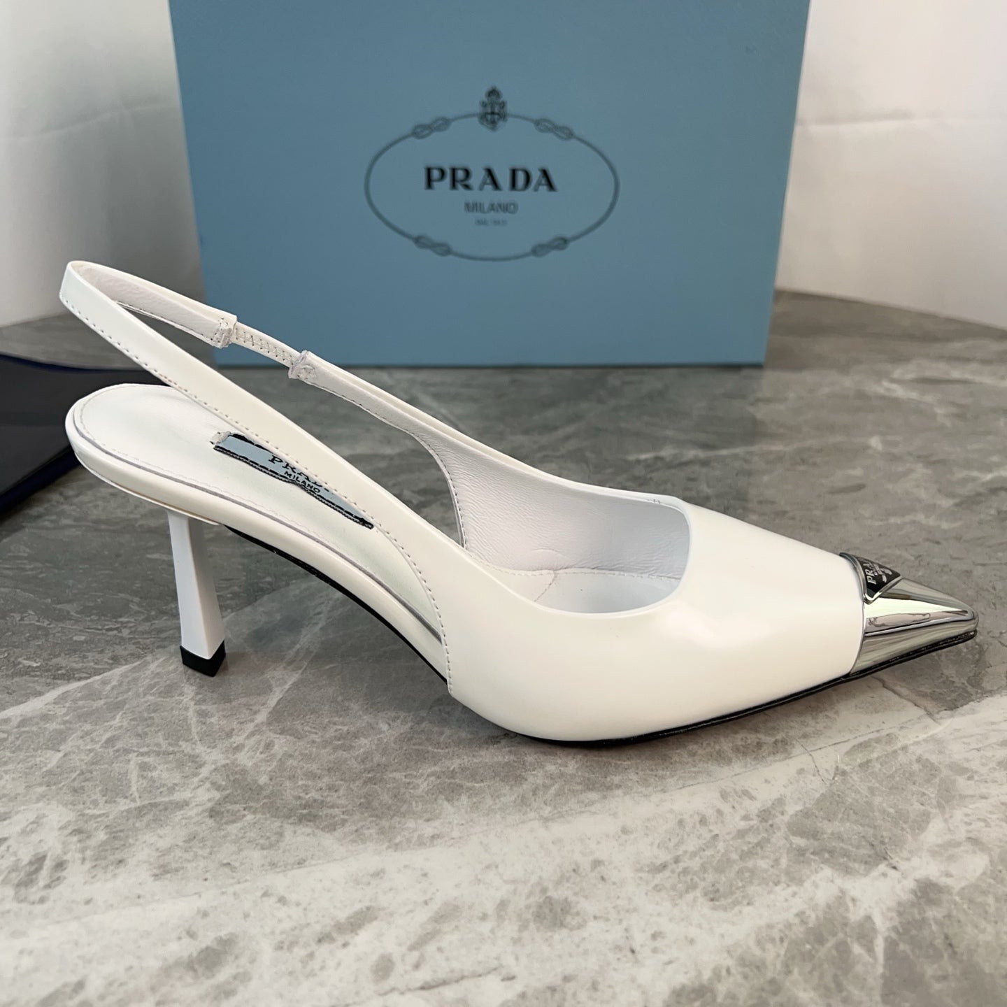 PRADA 25S METAL-TOE SLINGBACK PUMPS IN WHITE CALFSKIN