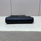 16 STRAP POCHETTE 18 IN BLACK SUPPLE CALFSKIN GOLD HARDWARE