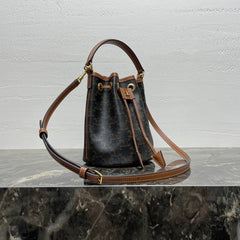 CLARA BAG 19 IN BLACK TRIOMPHE CANVAS AND BROWN CALFSKIN TRIM