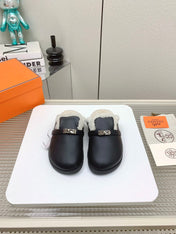 SLIP-ON MULE IN BLACK CALFSKIN AND SHEARLING LINING