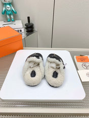 SLIP-ON MULE IN BLACK CALFSKIN AND SHEARLING LINING