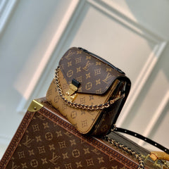 POCHETTE MÉTIS 20 IN BROWN MONOGRAM AND MONOGRAM REVERSE CANVAS GOLD BUCKLE