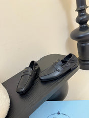 PRADA 25S SHUFFLE LOAFERS IN BLACK CALFSKIN