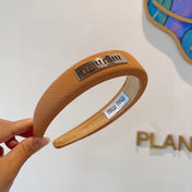 THICK HEADBAND IN BRONZE ORANGE DIAGONAL LEATHER 425479