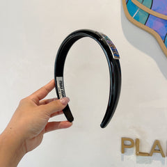 HEADBAND IN BLACK PATENT CALFSKIN SILVER LOGO 427344