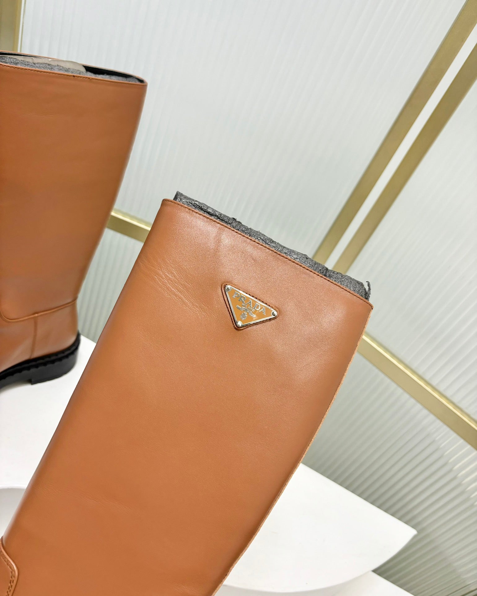 KNEE BOOTS WITH TRIANGLE LOGO IN CAMEL CALFSKIN