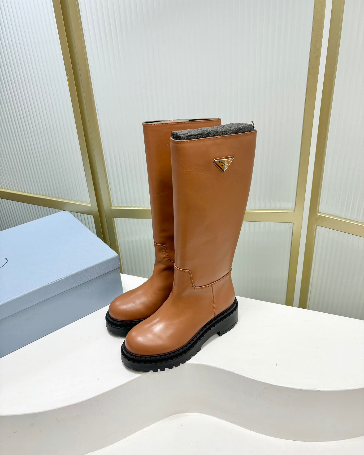 KNEE BOOTS WITH TRIANGLE LOGO IN CAMEL CALFSKIN