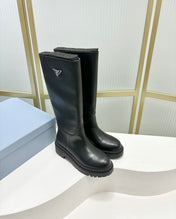 KNEE BOOTS WITH TRIANGLE LOGO IN BLACK CALFSKIN