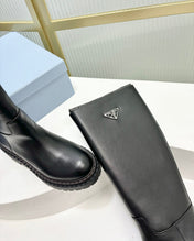 KNEE BOOTS WITH TRIANGLE LOGO IN BLACK CALFSKIN