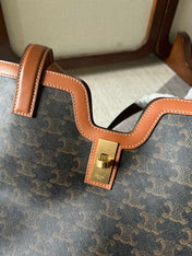 CABAS 37 IN BLACK TRIOMPHE CANVAS AND BRONZE BROWN CALFSKIN TRIM GOLD LOCK