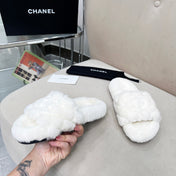 CHANEL 25S FUR SLIPPERS WITH EXPOSED-STITCH STRAPS IN WHITE