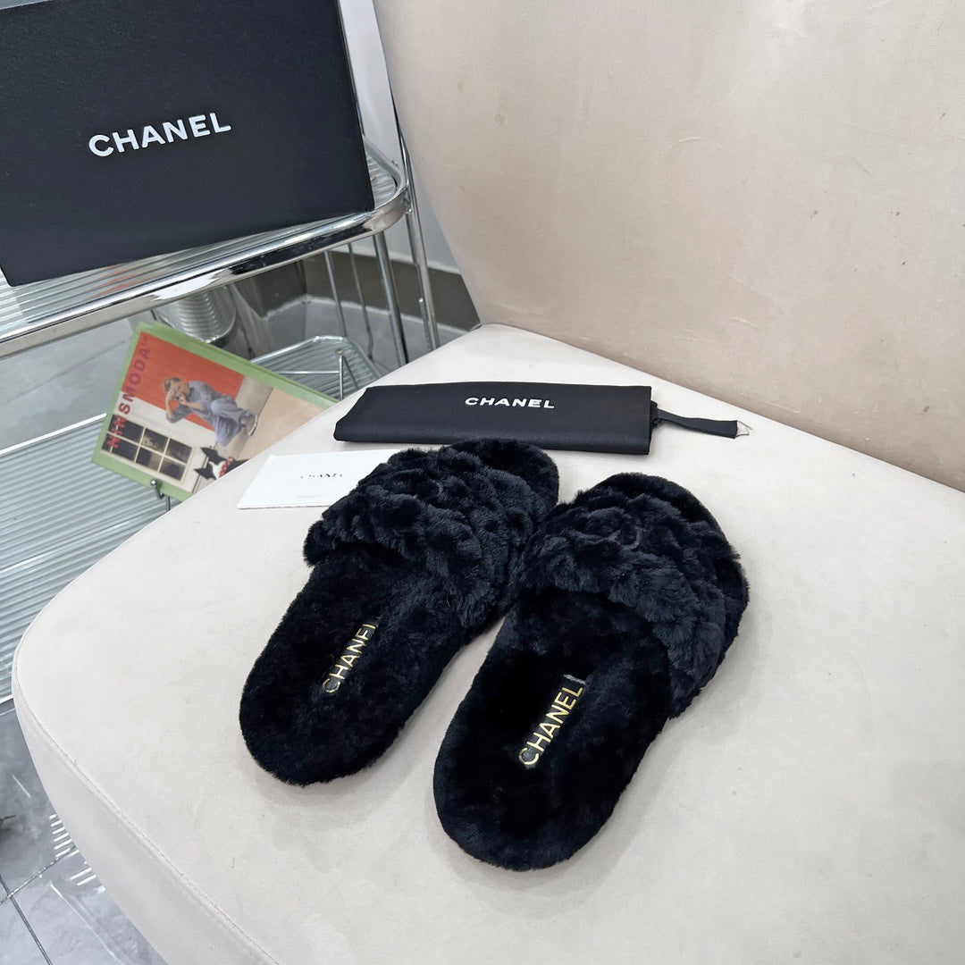 CHANEL 25S FUR SLIPPERS WITH EXPOSED-STITCH STRAPS IN BLACK