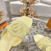 ISOLA FLAT SLIDE IN PALE YELLOW CALFSKIN