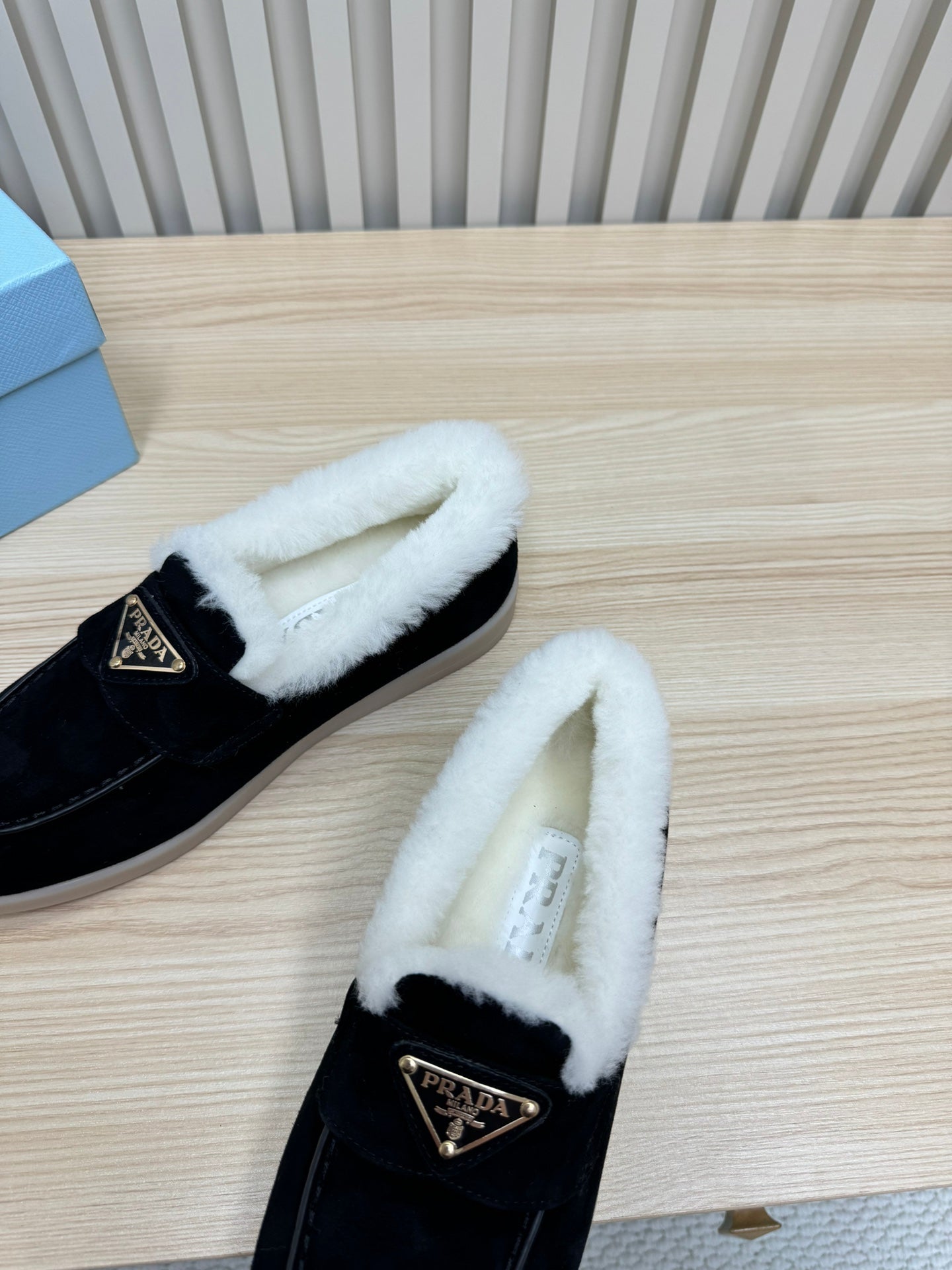 LOAFER IN BLACK SUEDE AND FUR LINING ATTACHED TRIANGLE LOGO