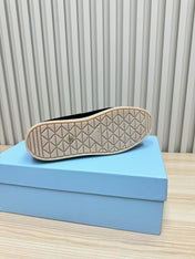 LOAFER IN BLACK SUEDE AND FUR LINING ATTACHED TRIANGLE LOGO